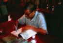 One of the Farmers who found the Terracota Warriors signing a book, Xian